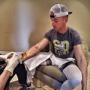 Nick receiving IV infusion after 34 mile ultra